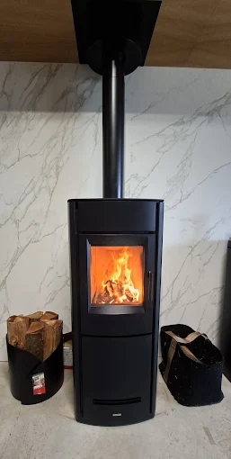 Installation d'un poêle à bois par Robine Energies & Bien-être à Granville